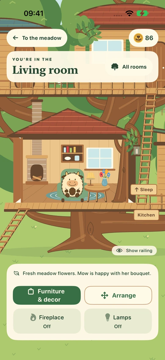 A furnished living room with Mow, an armchair, a rug and a fireplace